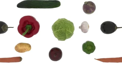Ripe fresh vegetables fly in front of the camera on a white background. A set of Stock Footage 148289616