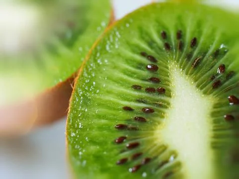 Ripe kiwi fruit macrophoto for background Stock Photos