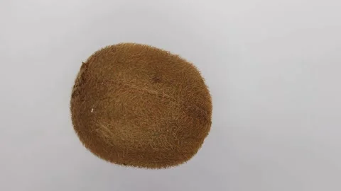 Ripe kiwi rotates in a circle Stock Footage 167026253