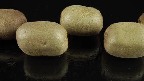 Ripe Kiwis on a Black Background. Stock Footage 257662408