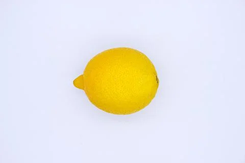Ripe lemon on light background Stock Photos