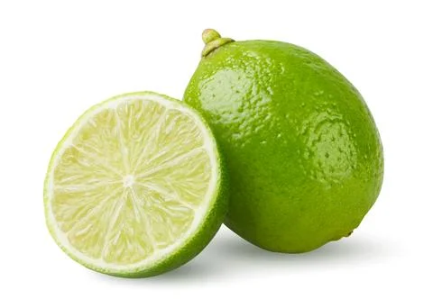 Ripe lime and half close-up on a white. Isolated Foto stock