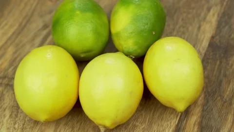 Ripe Limes Lemons, Close-up. Lime Lemons Rotate. Tropical Citrus Fruits, Isolate Stock Footage 165442055