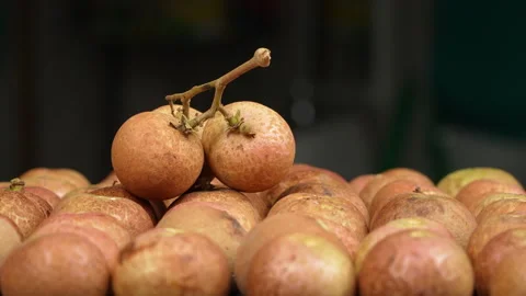 Ripe Longan Fruit Bunch Lying On Top Of Other Fruits Spinning Stock Footage 337233351