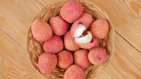Ripe lychees in a basket. Video stock 245834089