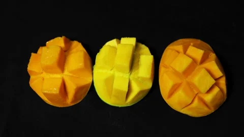 Ripe mango cubes prepared in hedgehog style highlighting freshness and sweetness Stock Footage 337140541