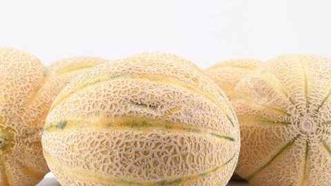 Ripe melons rotating, (loopable) on white background. Stock Footage 113668064