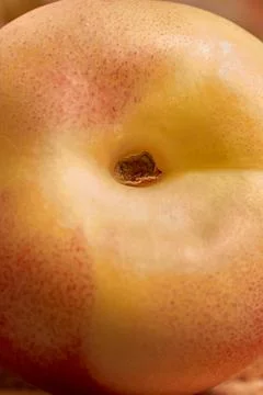 Ripe nectarine close-up. Selective focus, vertical format Stock Photos
