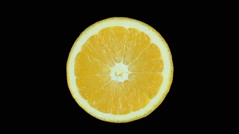 Ripe orange fruit in the section slowly rotates around its axis. Stock Footage 119686381