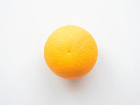 Ripe orange on a light gray surface Stock Photos