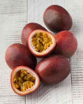 Ripe passion fruit on a white wooden background. exotic fruits Stock Photos