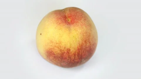 Ripe  peach fruit rotating on white background Stock Footage 35568984