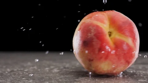 Ripe peach spins on the table. Slow motion Stock Footage 116687772