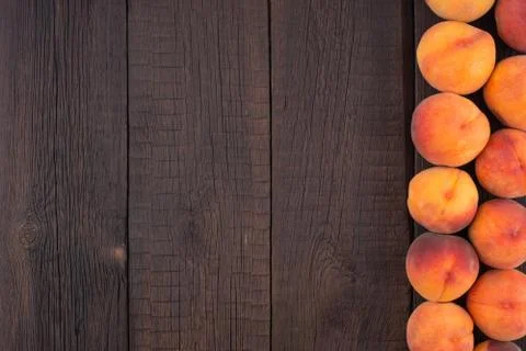 Ripe peaches on old rustic table. Stock Photos