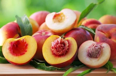 Ripe peaches on table Stock Photos