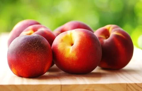 Ripe peachs on table Stock Photos