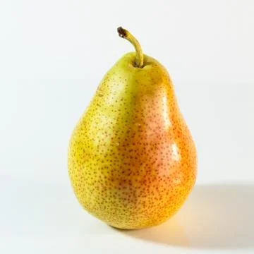 Ripe pear lying on the table Stock Photos