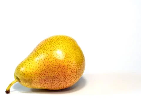 Ripe pear lying on the table Stock Photos