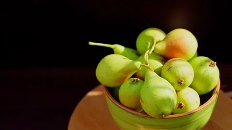 Ripe pears in a bowl. Pears revolve in a circle Stock Footage 196987424