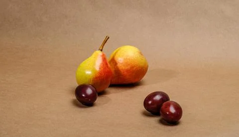 Ripe pears on a brown background 写真素材