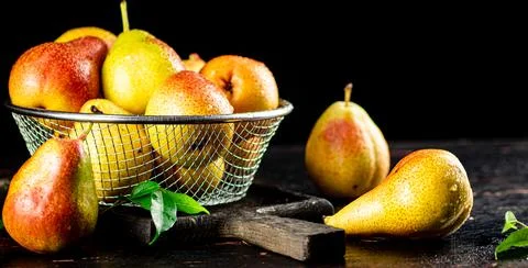Ripe pears in a colander. Stock Photos
