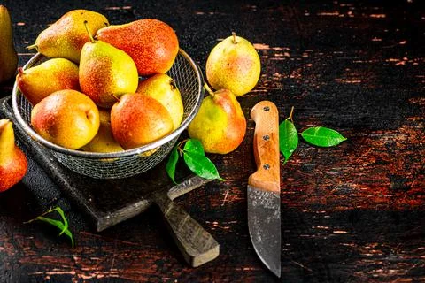Ripe pears in a colander. Stock Photos
