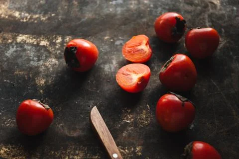 Ripe persimmon on rustic background Foto stock