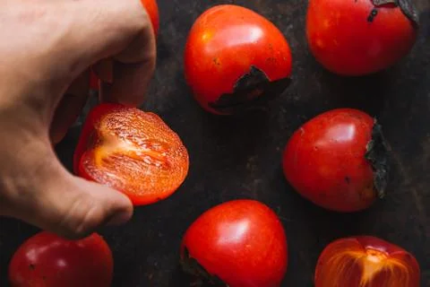 Ripe persimmon on rustic background Foto stock