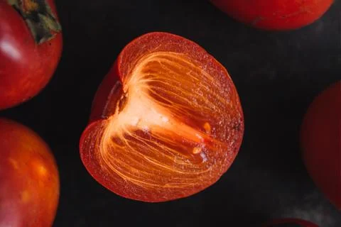 Ripe persimmon on rustic background Stock Photos