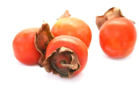Ripe persimmons Stock Photos