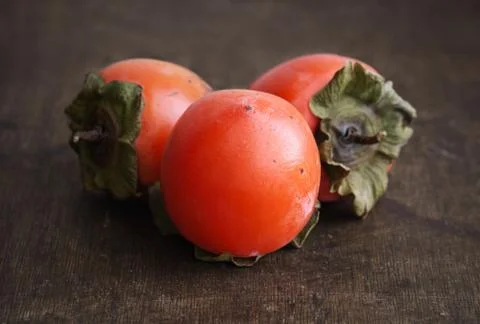 Ripe persimmons Stock Photos
