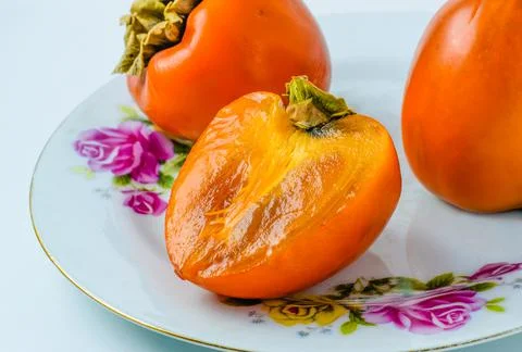 Ripe persimmons Stock Photos