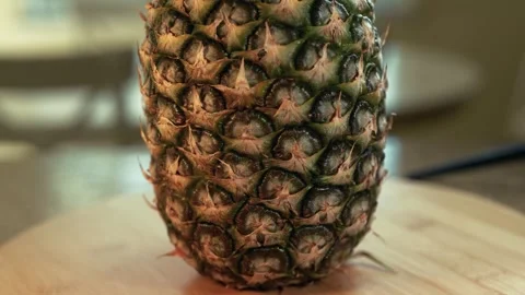 Ripe pineapple on a cutting board panning up Stock Footage 273281254