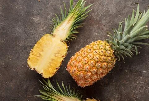Ripe pineapple on the table Stock Photos