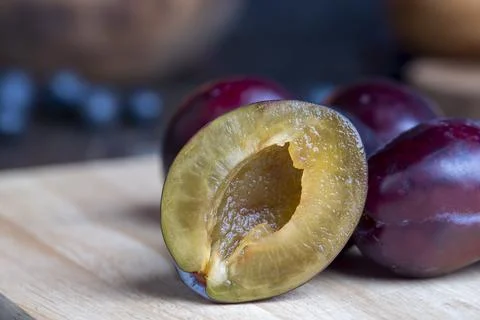 Ripe plums on the table in the kitchen Stock Photos