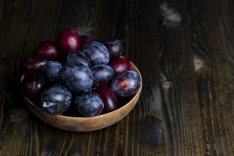 Ripe plums on the table in the kitchen Stock Photos