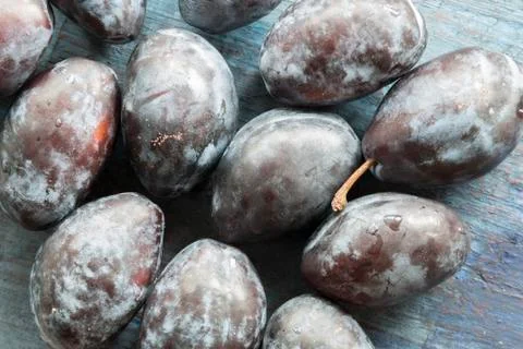 Ripe plums on the table. Stock Photos