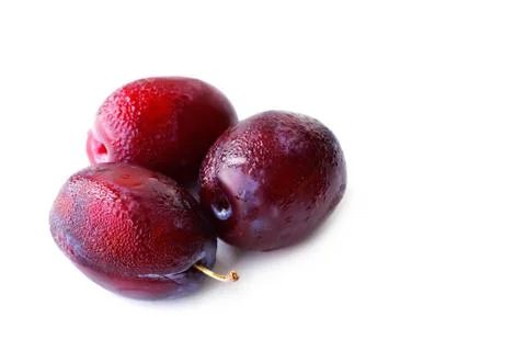 Ripe plums on white background Stock Photos