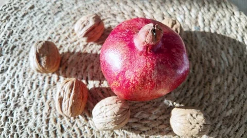 Ripe Pomegranate Fruit Surrounded By Walnuts Stock Footage 340461047
