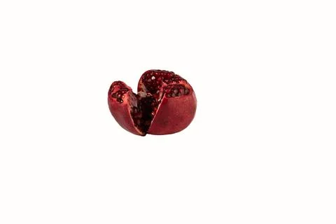 Ripe pomegranate fruit on a white background. Stock Photos