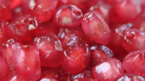 Ripe pomegranate seeds rotating in a loop Stock Footage 10804095