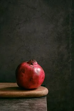 Ripe pomegranate on the table 스톡 사진