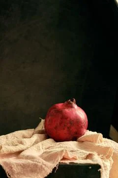Ripe pomegranate on the table Stock Photos
