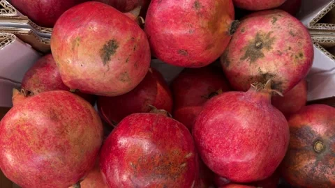 Ripe pomegranates in top view, tracking shot Stock Footage 321842826