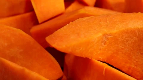 Ripe pumpkin slices rotate, making pumpkin puree or soup Stock Footage 232981772