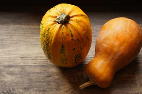 Ripe pumpkin on wooden table Stock Photos