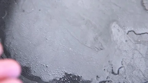 Ripe raspberry falls into the water on a dark background. Slow motion Stock Footage 114104696