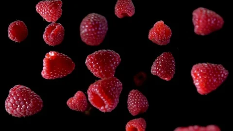 Ripe raspberry fly to the camera Video stock 105573868