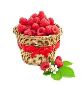 Ripe raspberry with green leaves in a basket. isolated on white background Stock Photos
