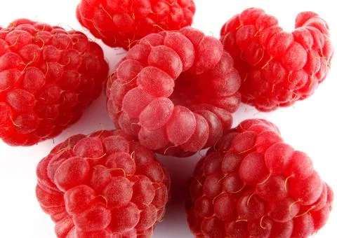 Ripe raspberry on a white background. Raspberry berries. Stock Photos